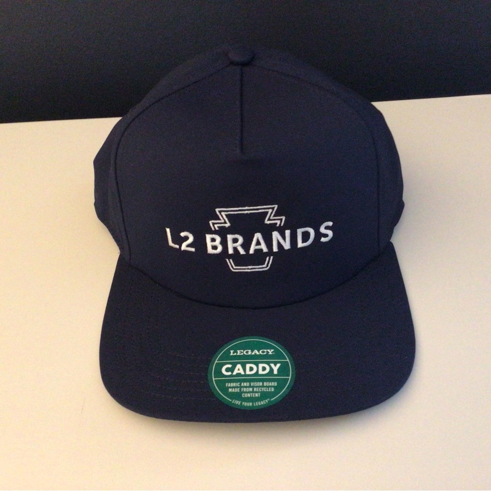 New. L2 Brands Legacy adjustable hat. Caddy style. Navy blue.